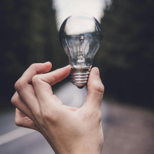 Hand Holding Lightbulb - Square-Color-Full